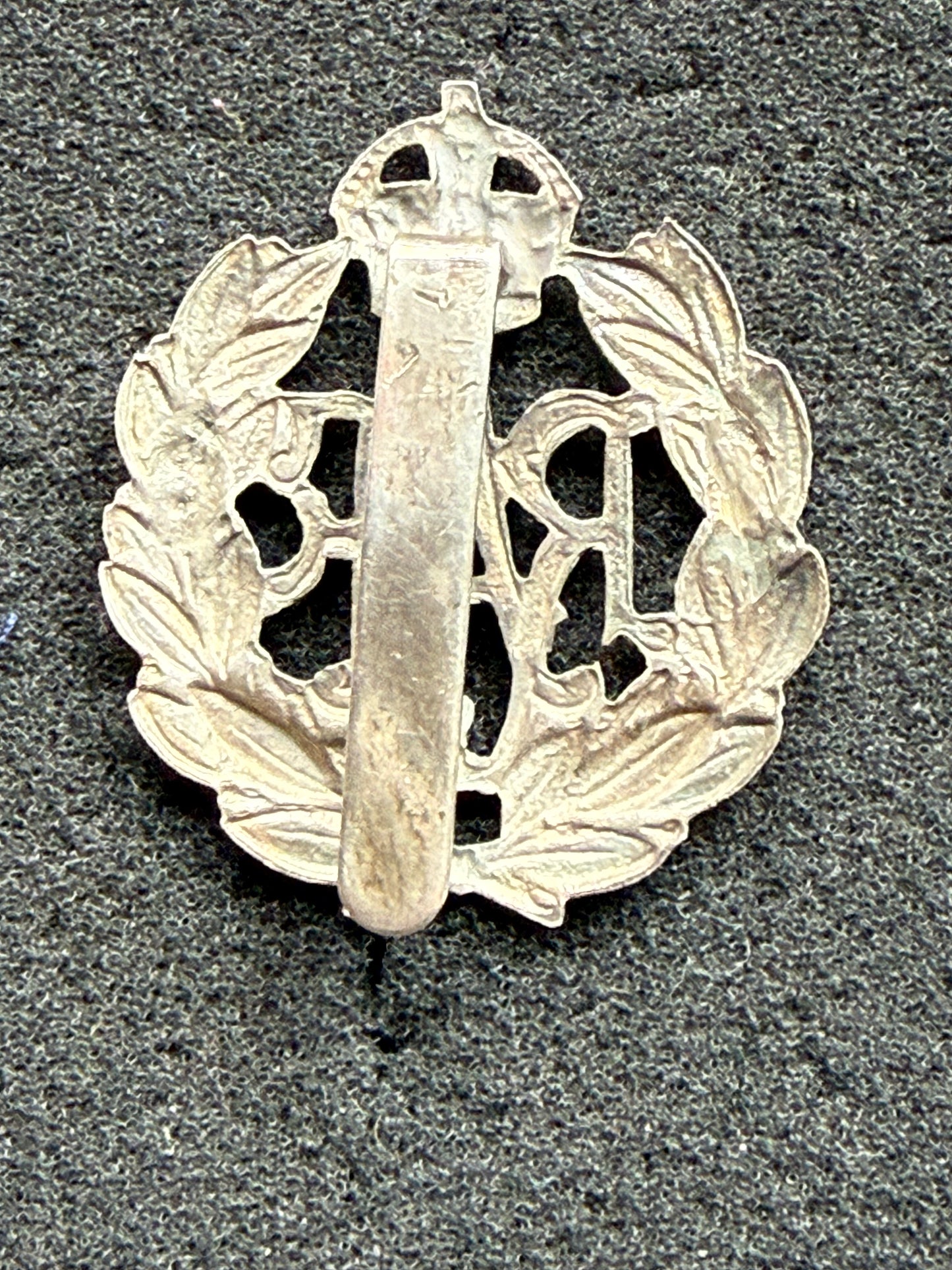 Post 1918 RAF band or police white metal cap badge with rear slider.