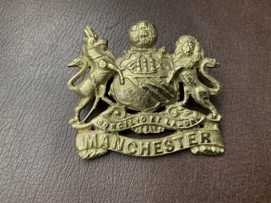Gradia Militaria - WW1 Egyptian made Manchester Regiment cap badge