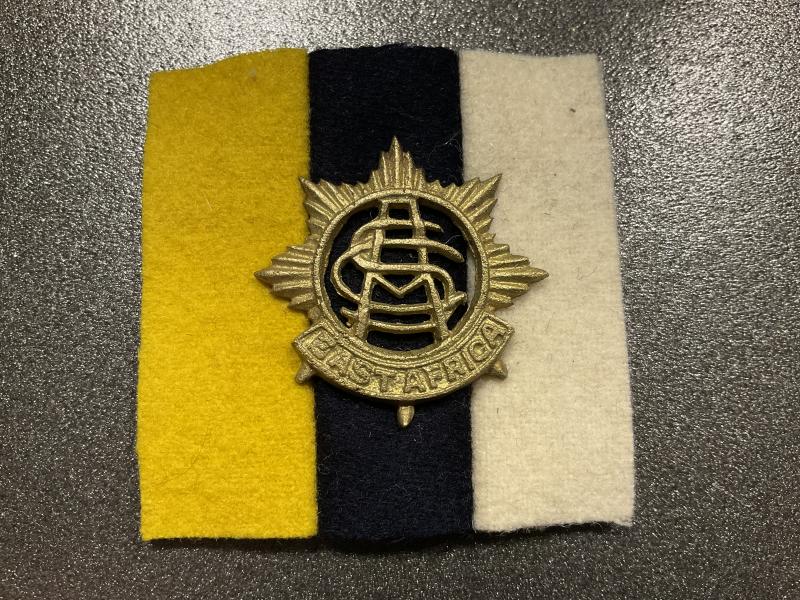 Gradia Militaria - East Africa Army Service corps cap badge and backing