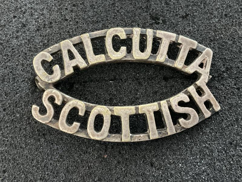 Gradia Militaria - Calcutta Scottish white metal shoulder title.
