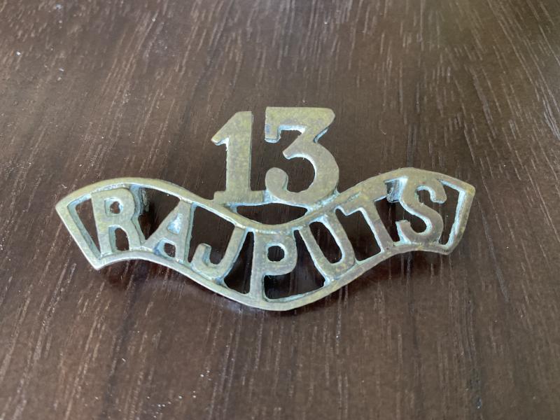 Gradia Militaria - 13th RAJPUTS Regiment brass shoulder title.