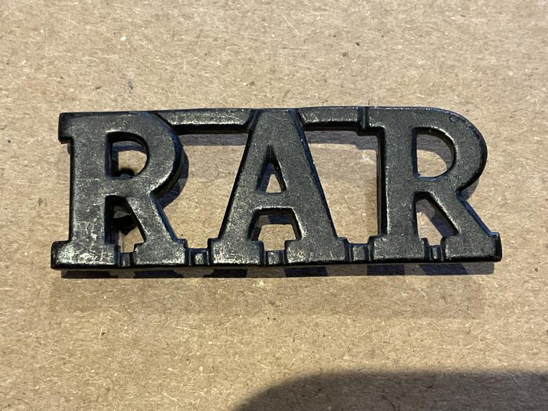 Gradia Militaria - Rhodesian African Rifles (R.A.R) blackened brass title.