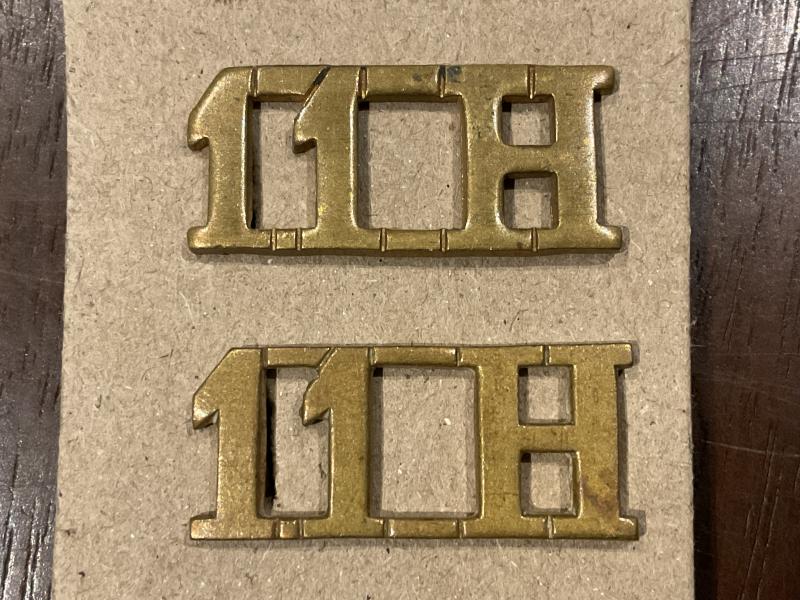 Gradia Militaria - WW1 11th Hussars brass shoulder titles