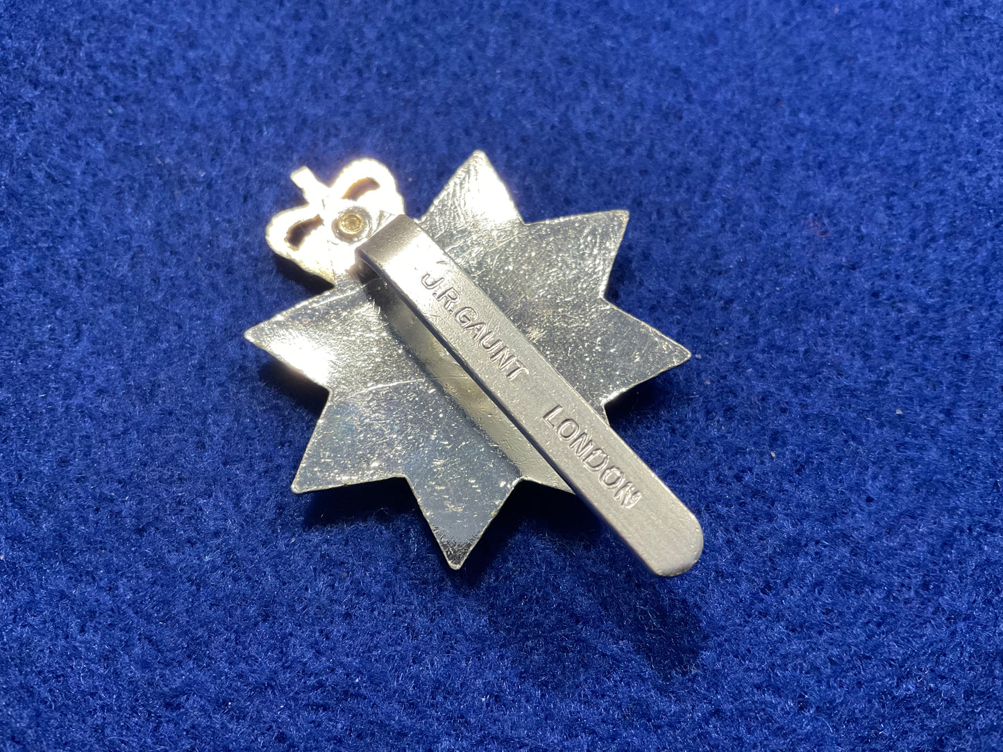 Anodised Queens Royal Surrey Regt cap badge by Gaunt