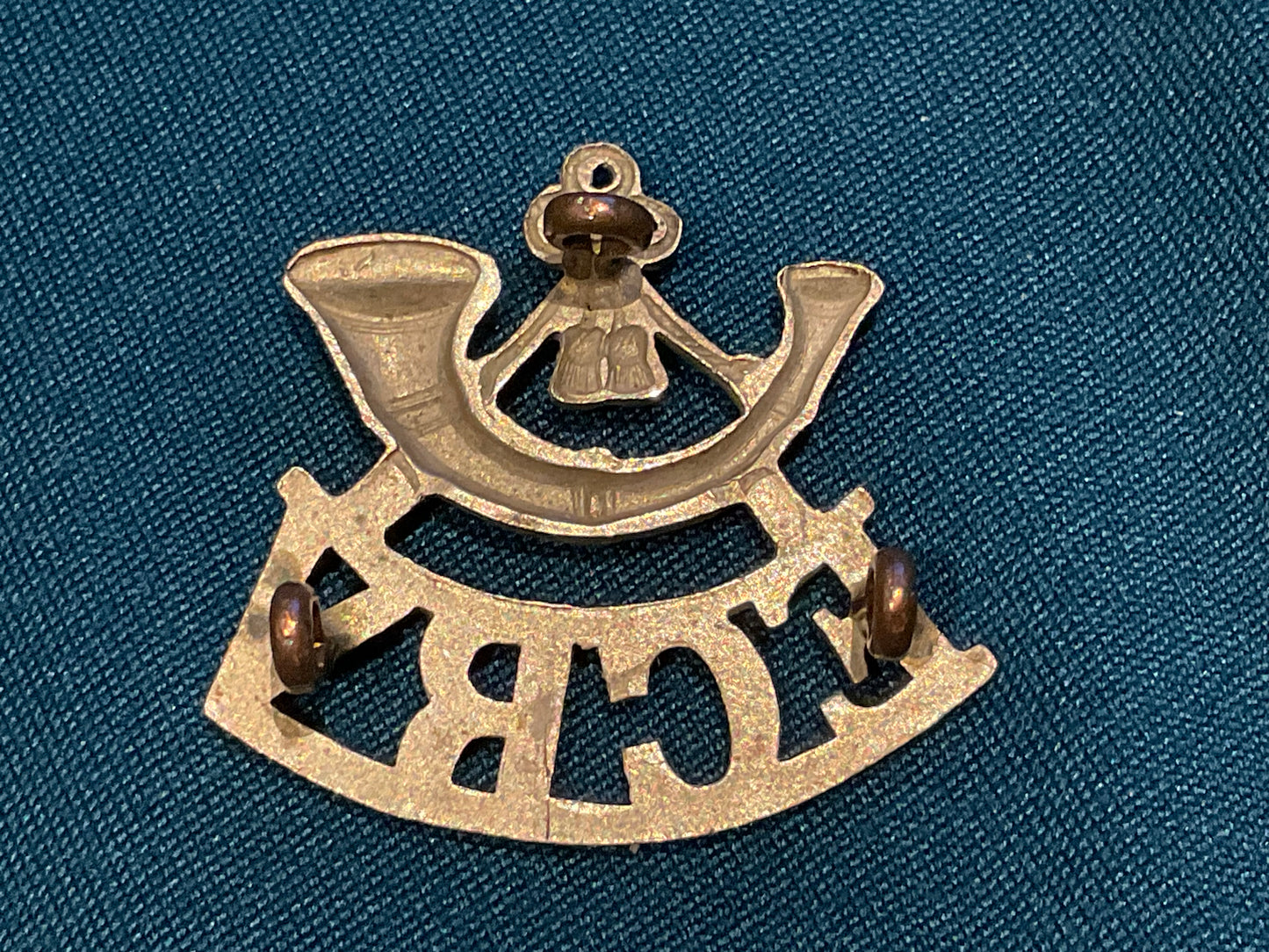 White metal E.C.R.V. (East Coast Rifle Volunteers) shoulder title.