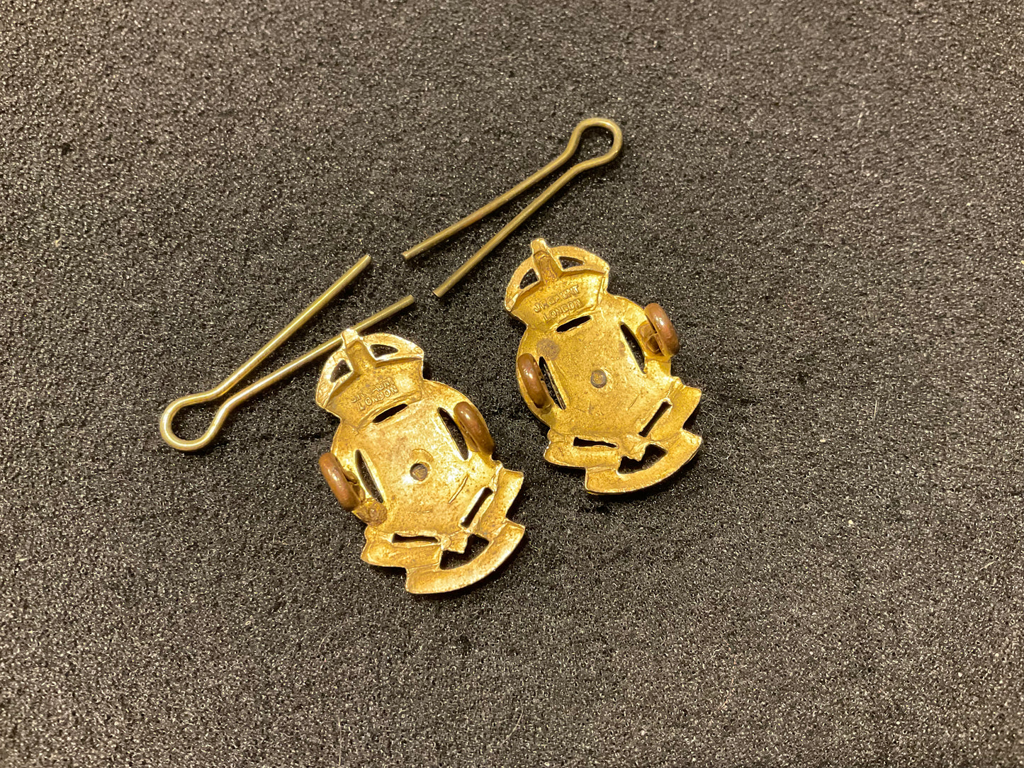 Pre 1952 R.A.O.C officers silver & gilt collar badges.