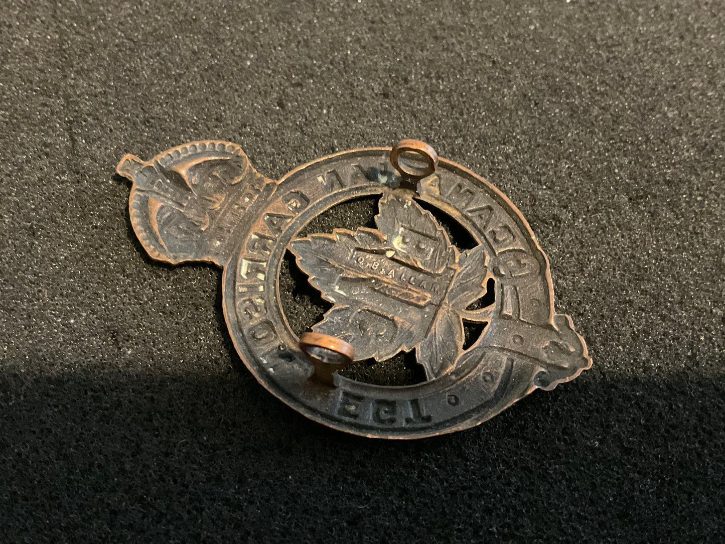 WW1 C.E.F 11th Battalion Garrison Regiment Officers cap badge.