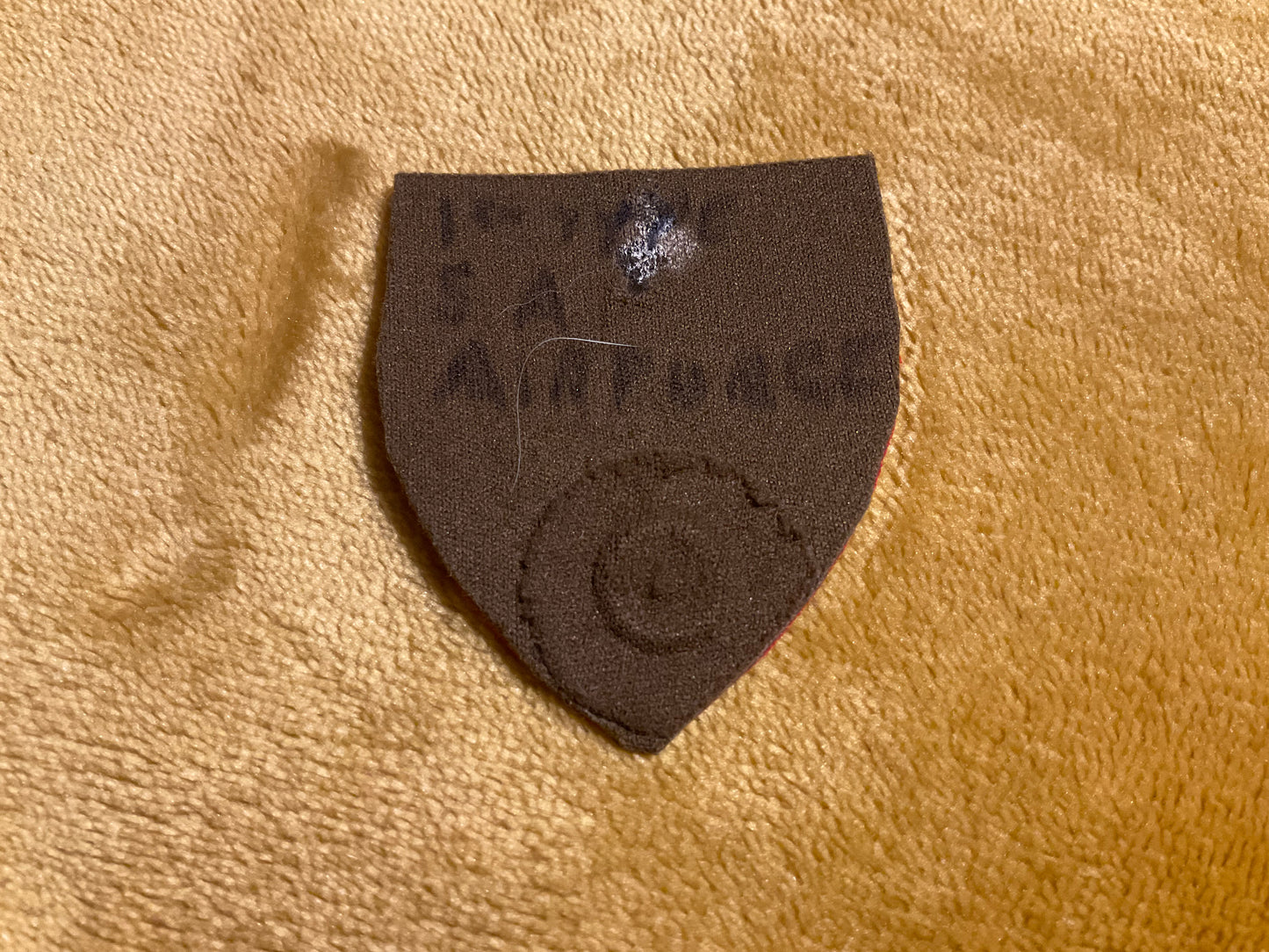 South African Army Dog (K9) Centre rubberised beret badge.