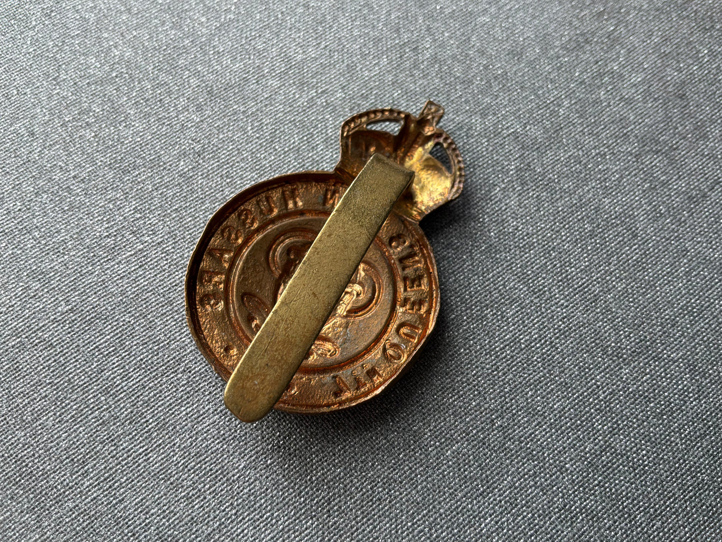 WW1 Economy brass 7th Queens Own Hussars cap badge.