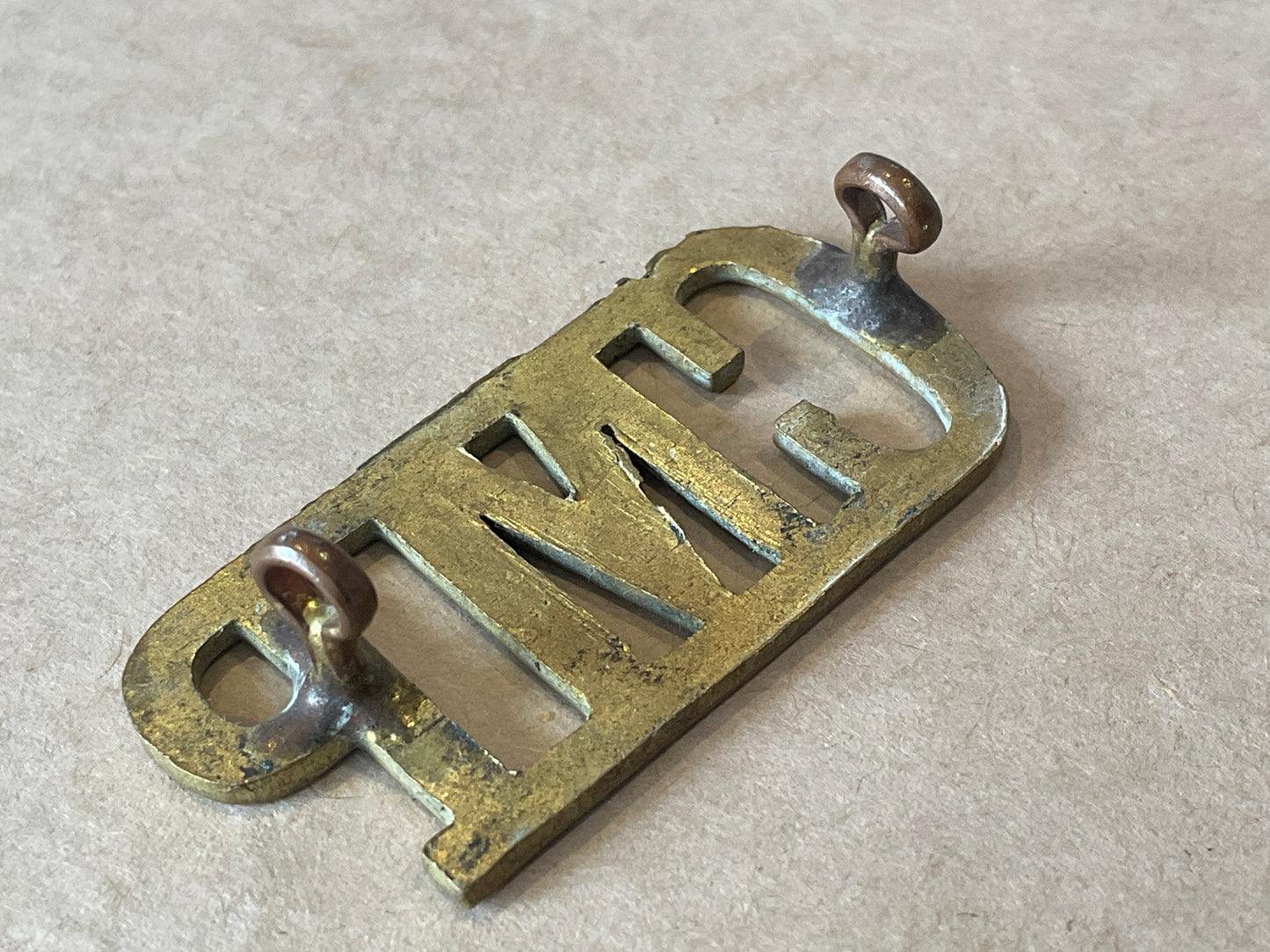 WW1/2 C.M.P (Corps of Military Police) brass shoulder title.