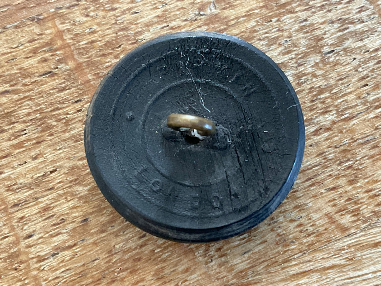 Post 1952 Kings African Rifles black horn button.