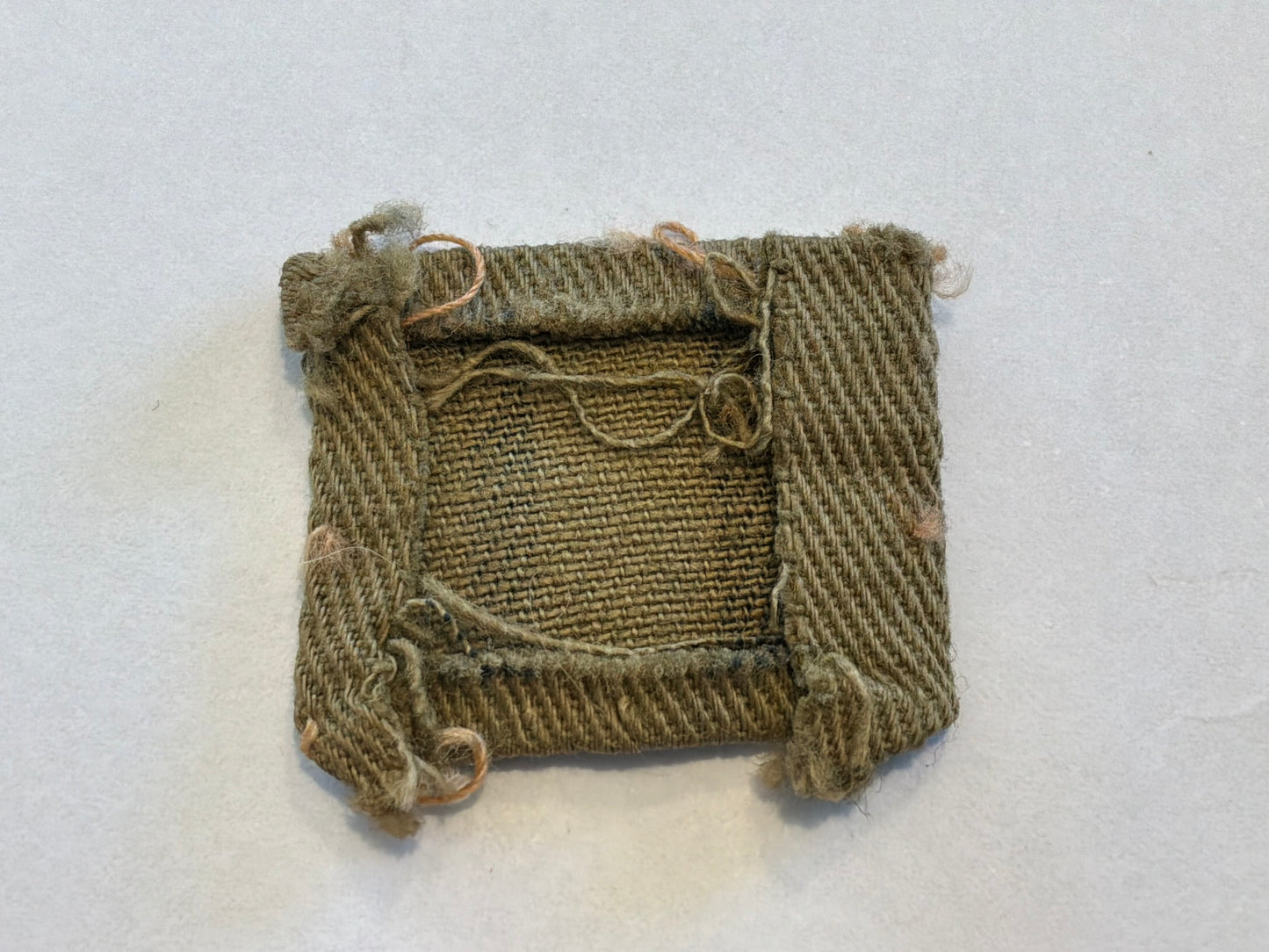 WW2 Printed number ‘11’ Home Guard designation badge.