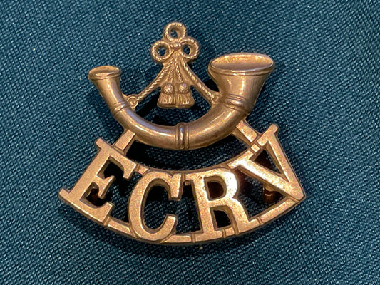White metal E.C.R.V. (East Coast Rifle Volunteers) shoulder title.