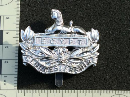 Gradia Militaria -  Gloucestershire Regiment anodised cap badge