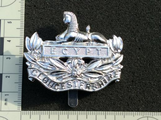 Gradia Militaria -  Gloucestershire Regiment anodised cap badge