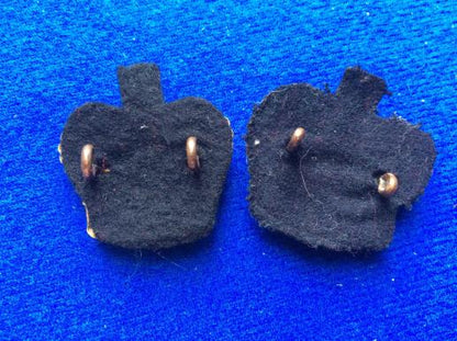 Post 1952 brass Queens Crowns with black backing