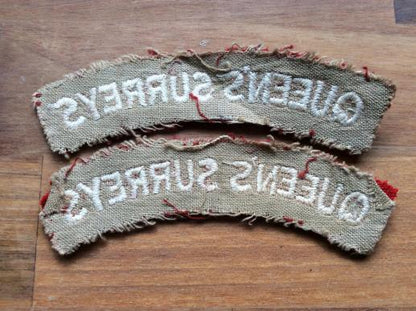 Pair of cloth QUEENS SURREYS Shoulder titles