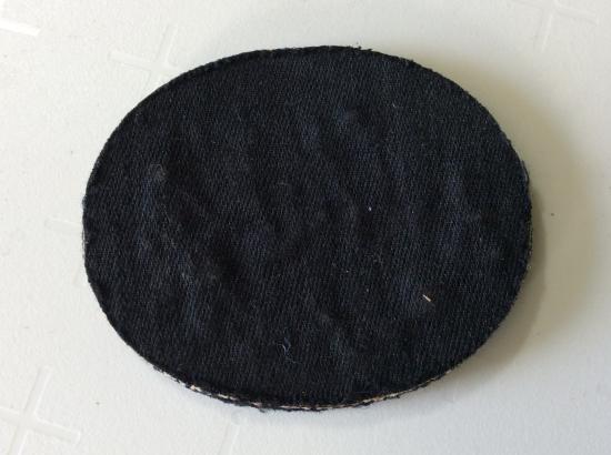 M.G ( Machine Gun) good bullion on dark blue wool trade badge