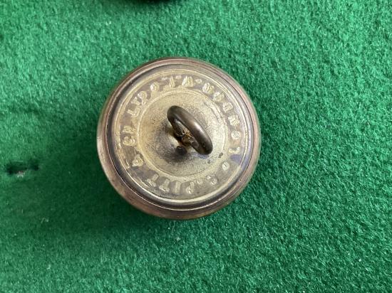 The Sussex Regt brass button by Pitt
