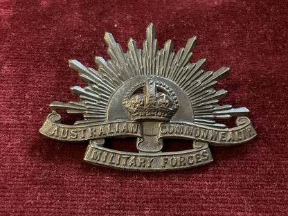 Gradia Militaria -  WW2 rising sun A.I.F cap badge by STOKES