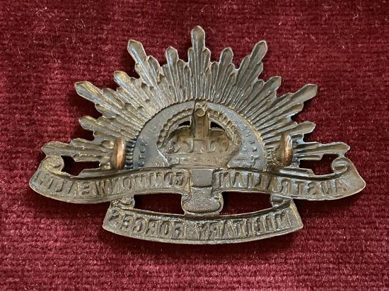 WW2 rising sun A.I.F cap badge by STOKES