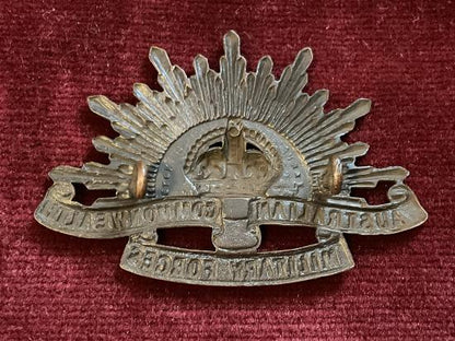 WW2 rising sun A.I.F cap badge by STOKES