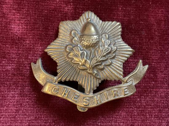 Gradia Militaria -  WW1 Cheshire regiment brass economy cap badge