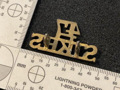 47th Sikhs brass shoulder title