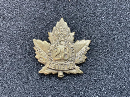 Gradia Militaria -  WW1 C.E.F 28th Infantry Battalion brass collar badge