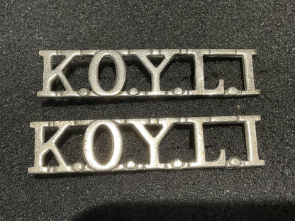 K.O.Y.L.I white metal shoulder titles