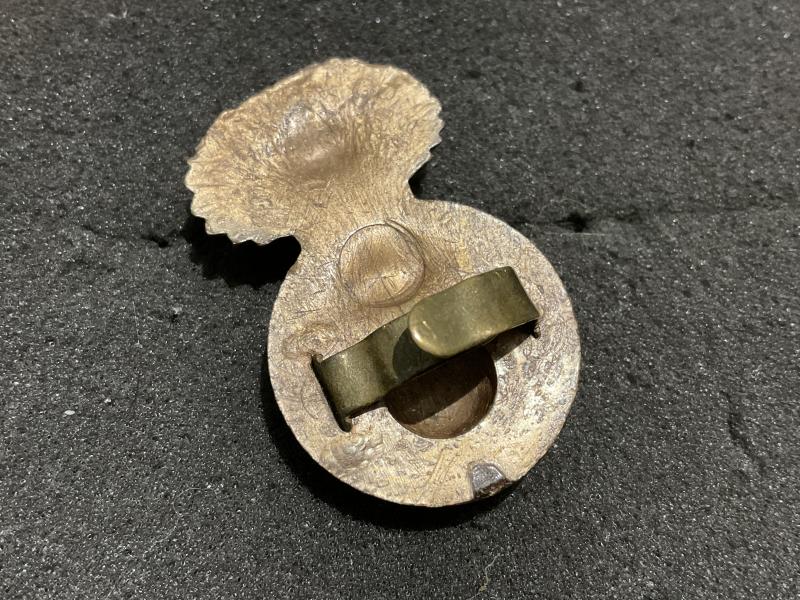 WW2 Royal Welch Fusiliers plastic economy cap badge