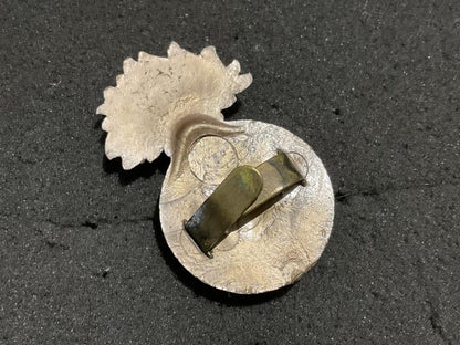 Gradia Militaria -  WW2 Northumberland Fusiliers plastic economy cap badge