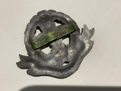 WW2 Middlesex Regiment plastic economy cap badge