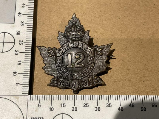 Gradia Militaria -  WW1 C.E.F 12th Mounted Rifles cap badge