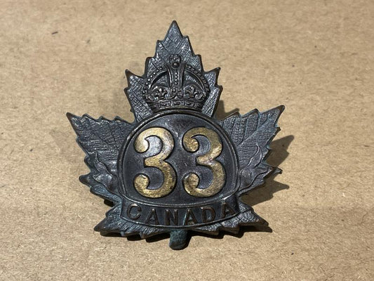 Gradia Militaria -  WW1 C.E.F 33rd Battalion cap badge
