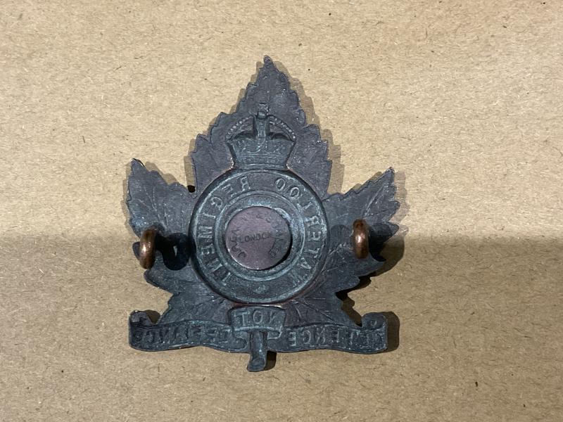 WW1 C.E.F 29th Waterloo Regt cap badge by Gaunt