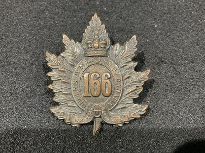 Gradia Militaria -  WW1 CEF 166th Inf Btn, Queens Own Rifles cap badge