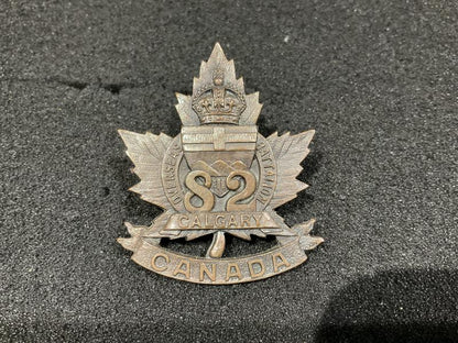 Gradia Militaria -  WW1 CEF 82nd Calgary Battalion cap badge by BLACK