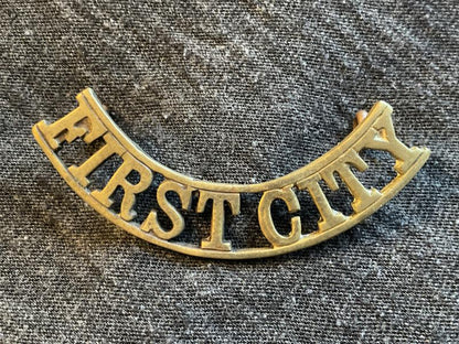 Gradia Militaria -  South African First City  brass shoulder title 1932-60