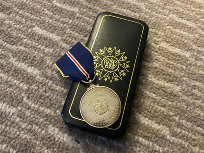 Malaysia; Order of the Defender of the Realm medal.