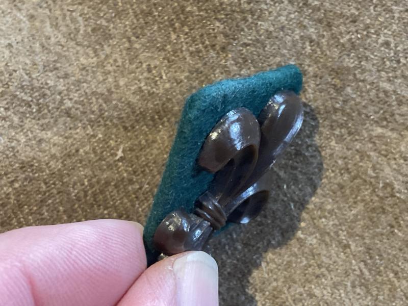 WW2 Economy plastic Manchester Regiment cap badge