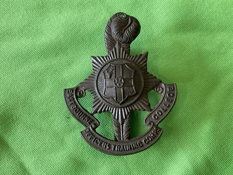 Gradia Militaria -  Eastbourne College O.T.C dark bronze finished cap badge