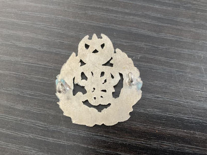 Pakistan Police cap badge.