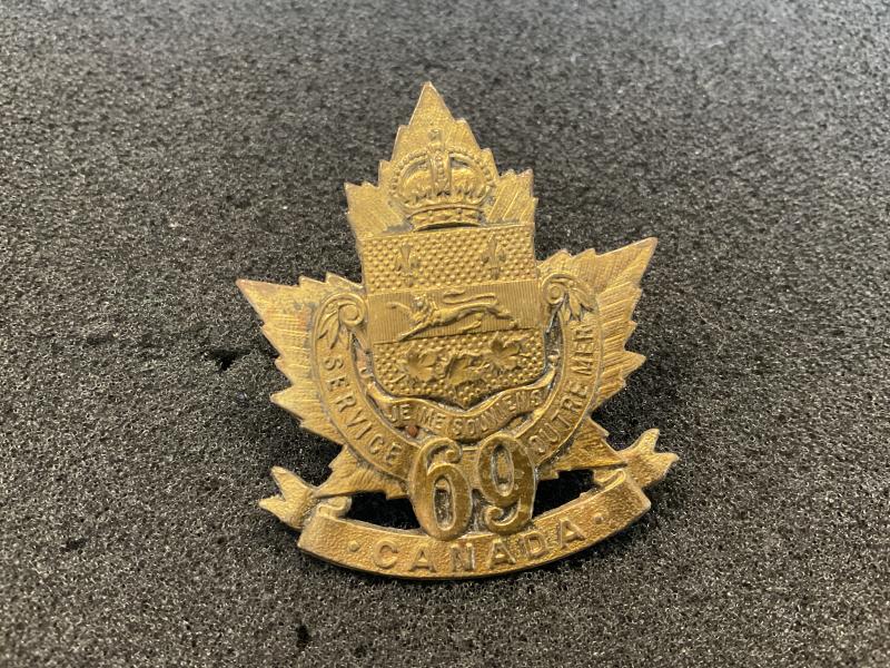 Gradia Militaria -  WW1 C.E.F 69th Infantry Battalion cap badge.