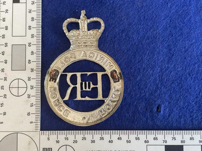 Q/C Royal Dominica Police Force helmet plate.