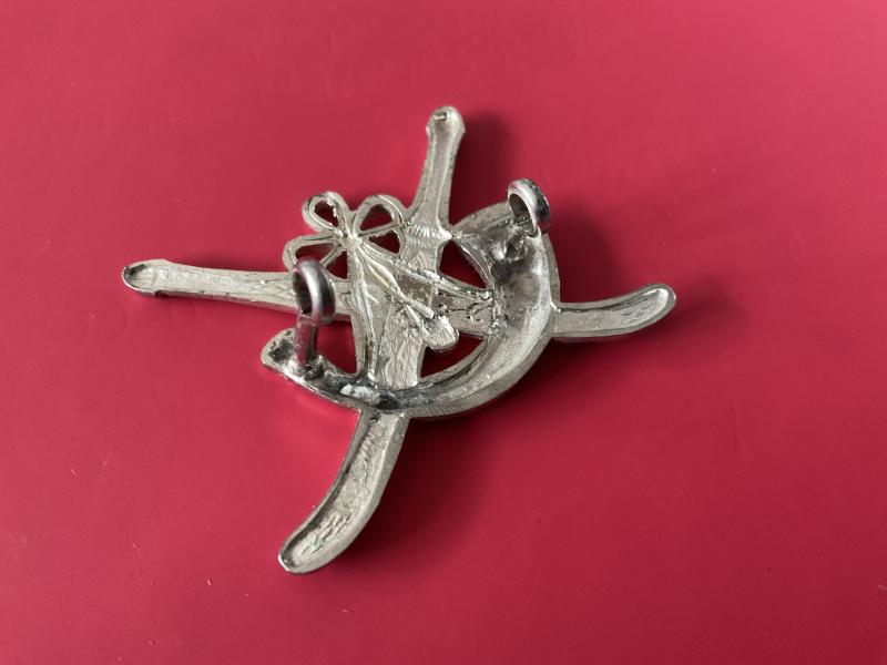 Oman Frontier Regiment cap badge.