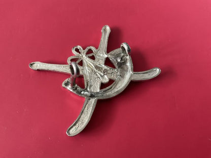 Oman Frontier Regiment cap badge.