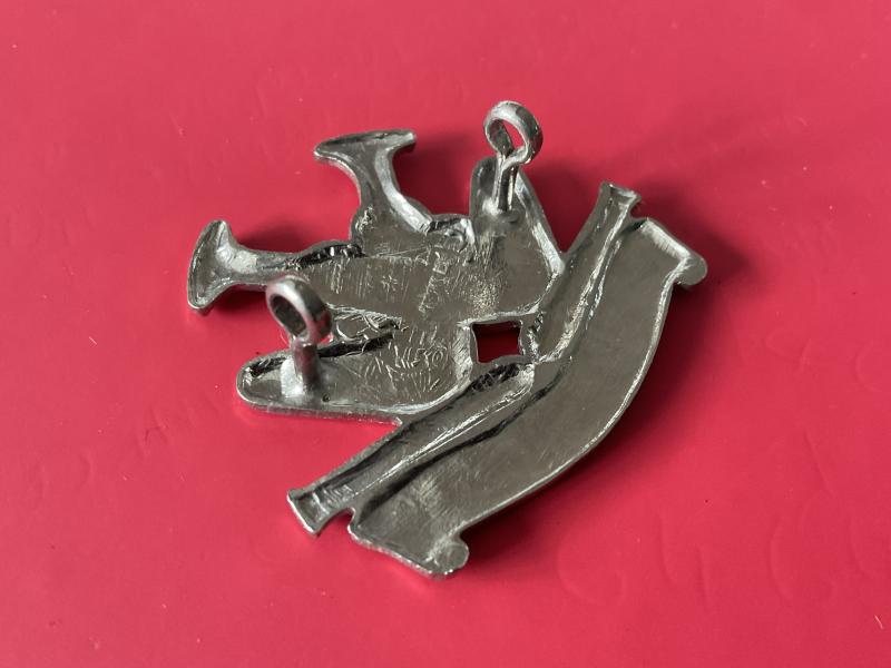 Oman Coast Regiment cap badge.