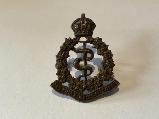 Gradia Militaria -  WW1 Canadian Medical Corps bronzed cap badge.