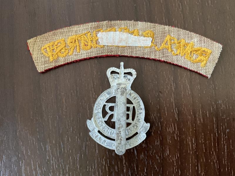 Royal Military Academy Sandhurst cap badge and shoulder titles.